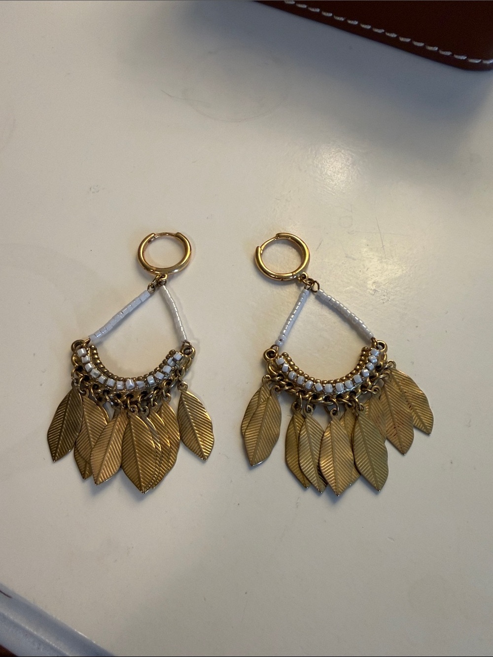Gold Tone White Beaded Feather Drop Earrings